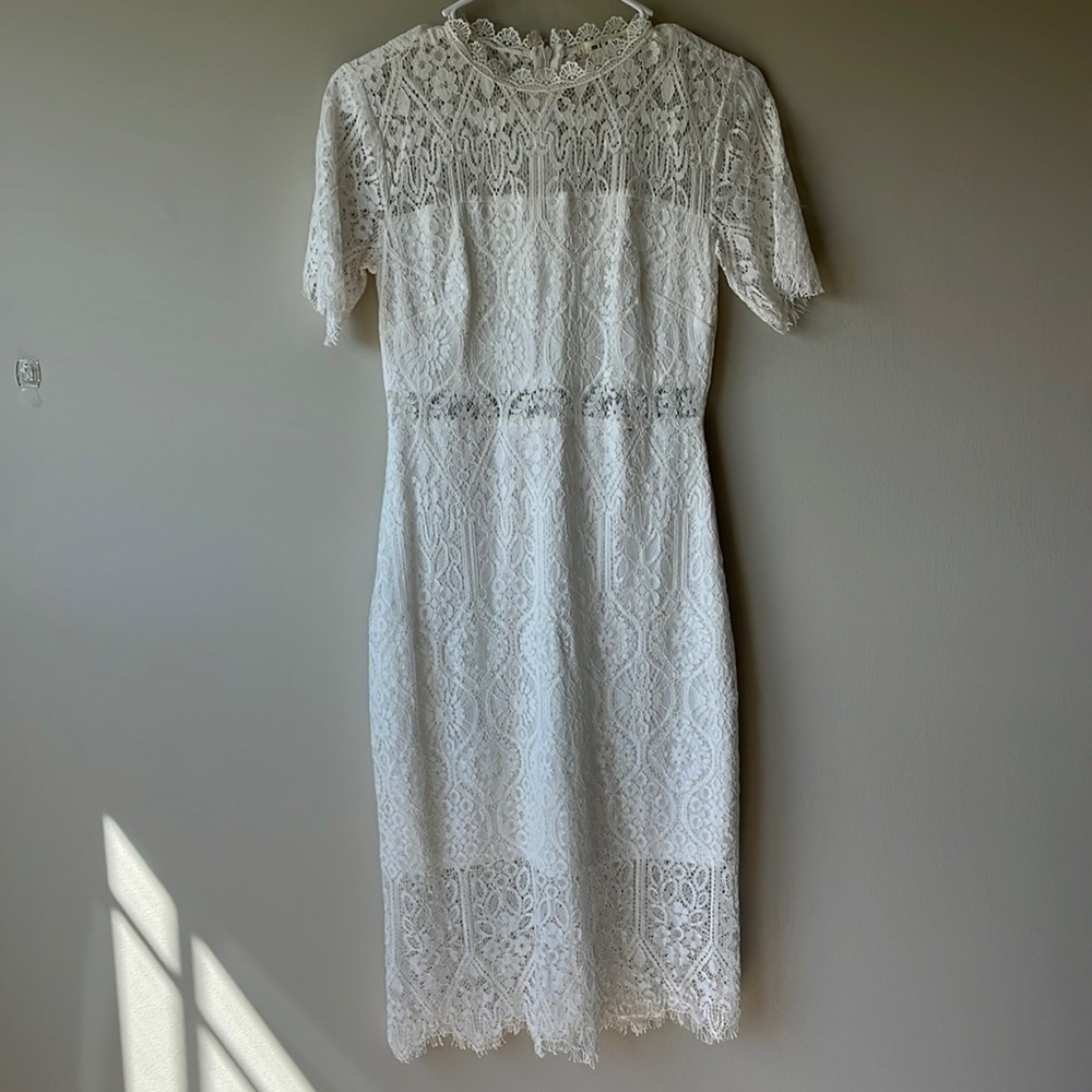 White lace dress size XS with cut out middle
